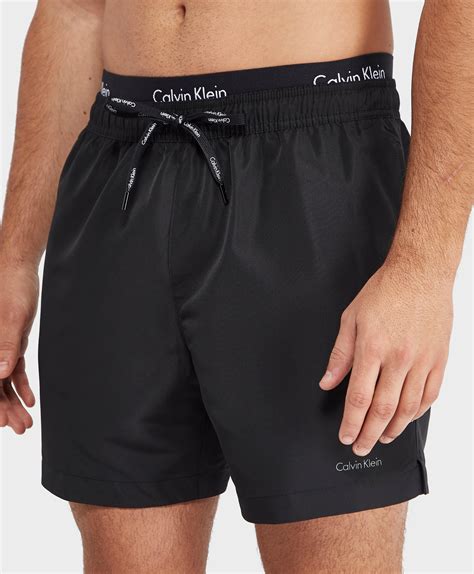 Calvin klein swim trunks - Calvin Klein Jeans, Underwear & Accessories. Calvin Klein has been an iconic fashion brand since 1968, known for its sexy and fashionable clothing, underwear, shoes, and accessories. Whether looking for comfortable and stylish jeans, tees, hoodies, and sneakers for a casual look or elevated wardrobe staples from the Menswear and Womenswear ...